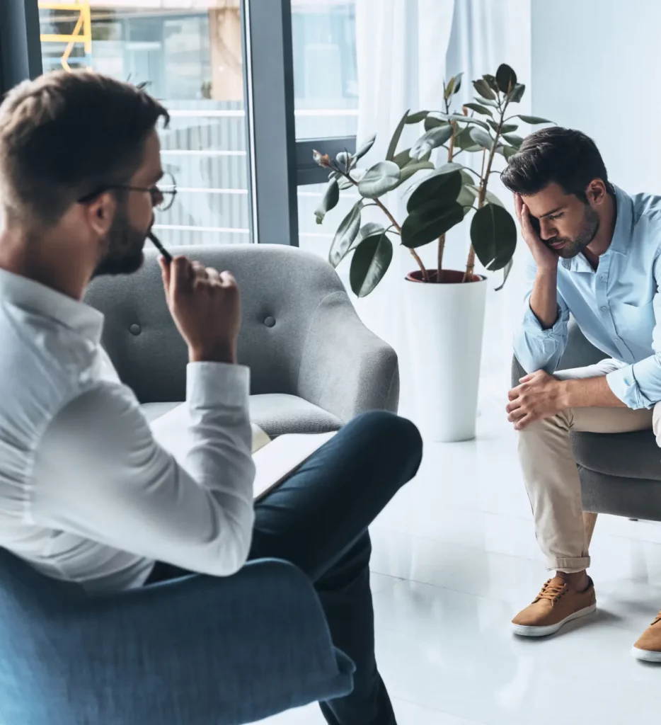 Addiction counsellor speaking with a man at a private outpatient alcohol drug addiction rehab center in Vancouver.