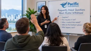 Addiction professional answering questions about alcohol withdrawal during a group education session.